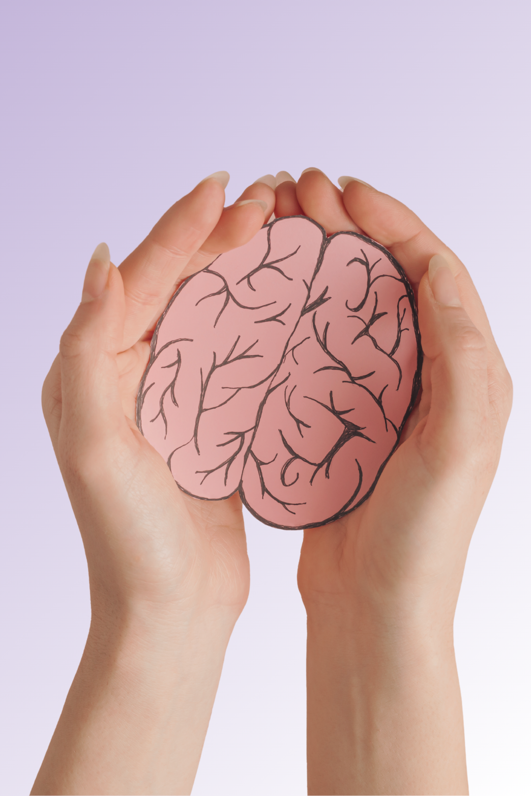 Hands holding cutout of brain representing mental health